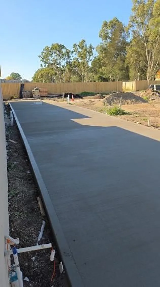 Long new driveway with the formwork still in place