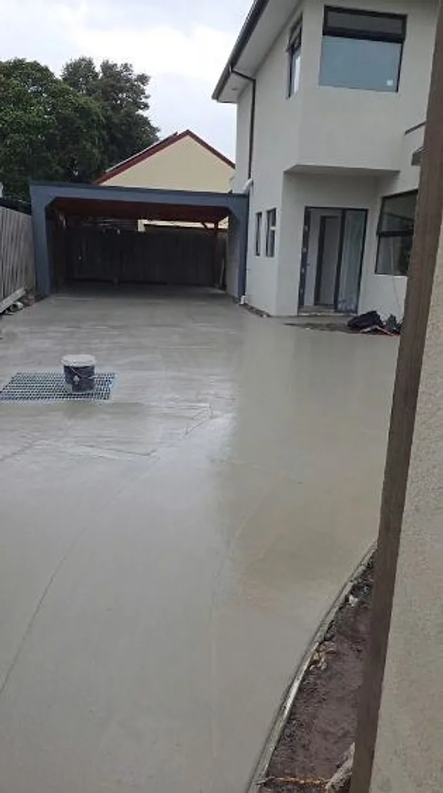 New slab poured in front of a double garage