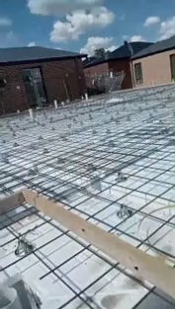 Mesh laid over waffle pods before the pour